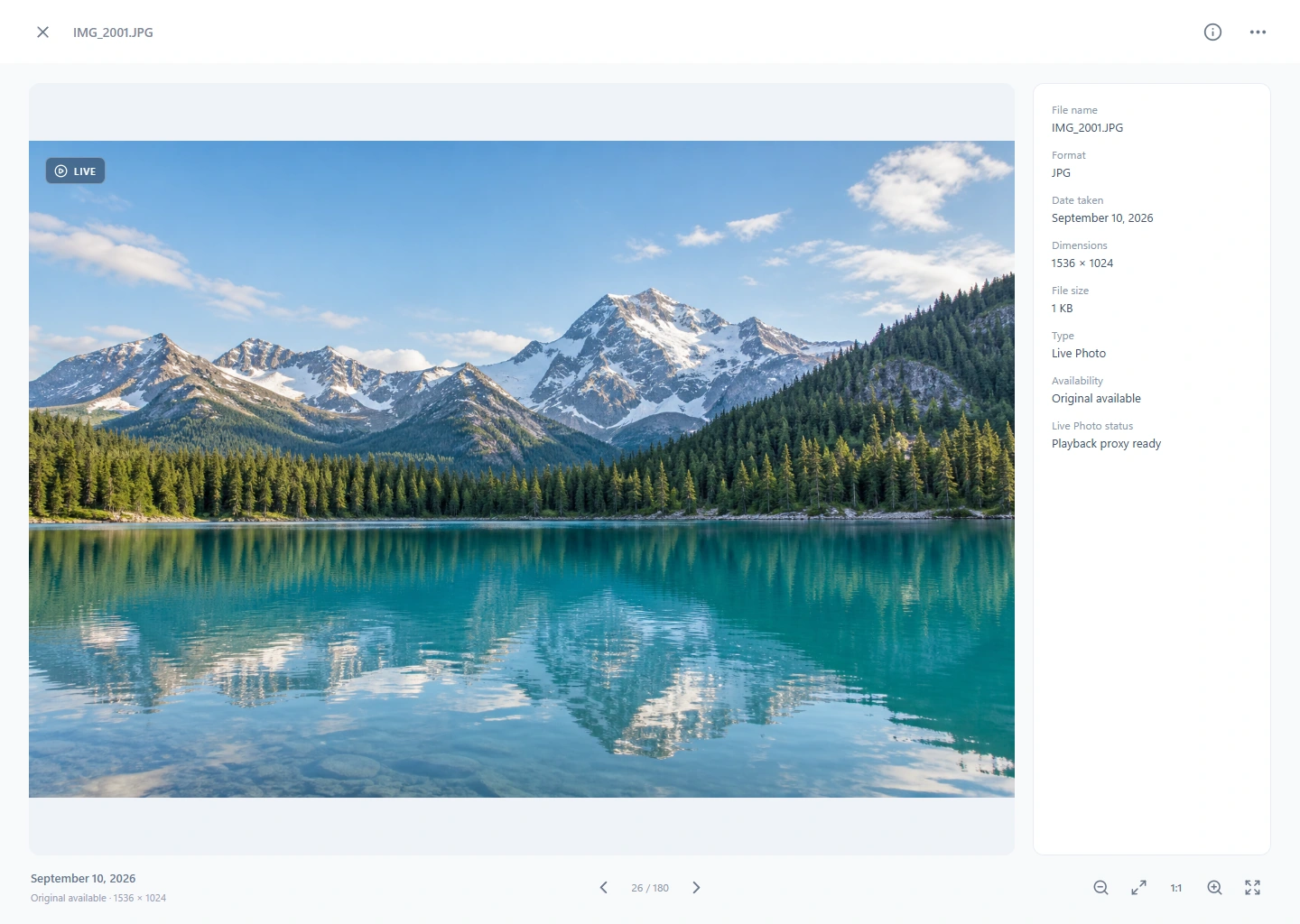 PhotoKeeper viewer showing a mountain lake and Live Photo playback controls